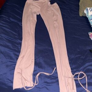 Feel sillyhas cut outs on both sides of hips and ties at the bottoms of the legs